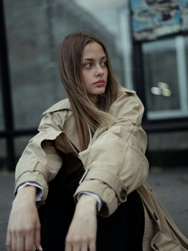 Woman in a beige trench coat